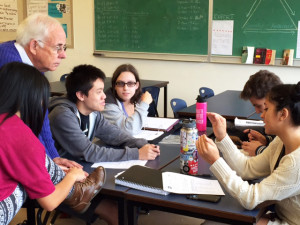 Volunteer Rod Cox helps Franklin High School students during a resume building workshop.